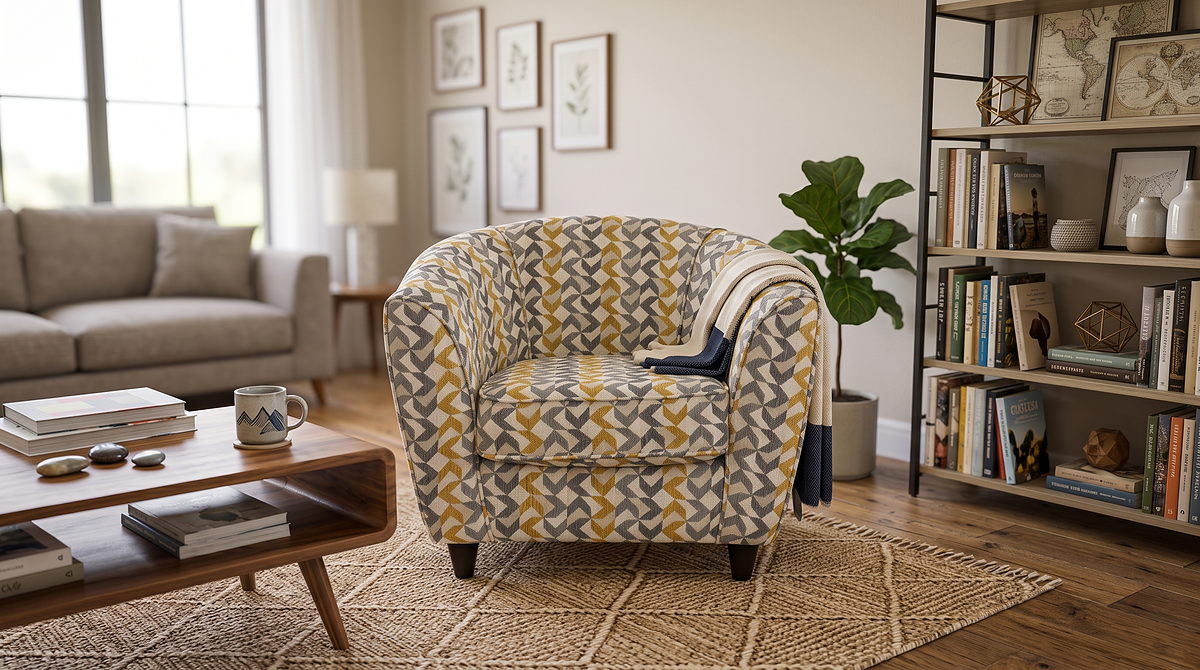 Mary tub chair in mustard and grey geometric fabric in a living room setting
