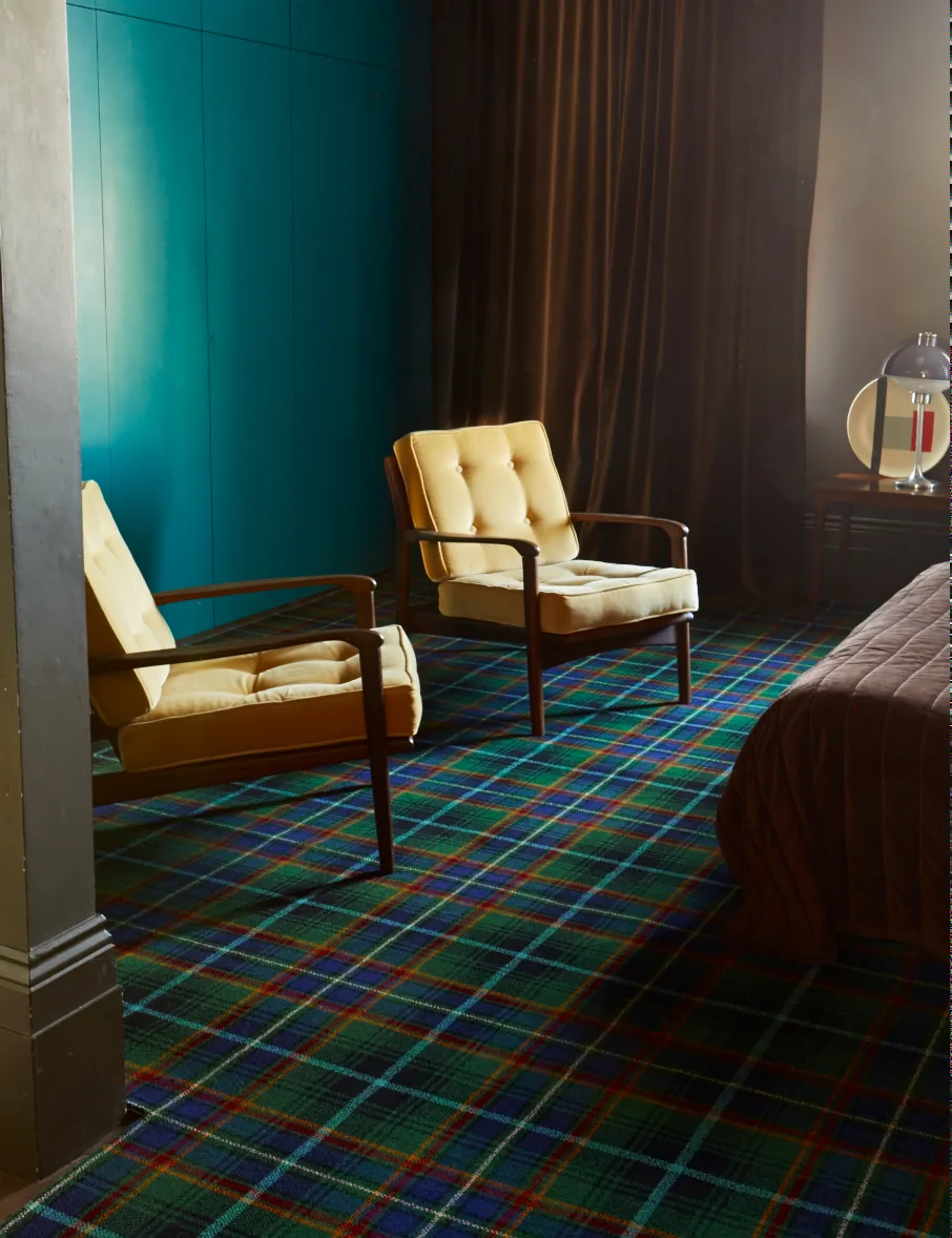Brintons Abbotsford MacInnes tartan carpet in a teal sitting room