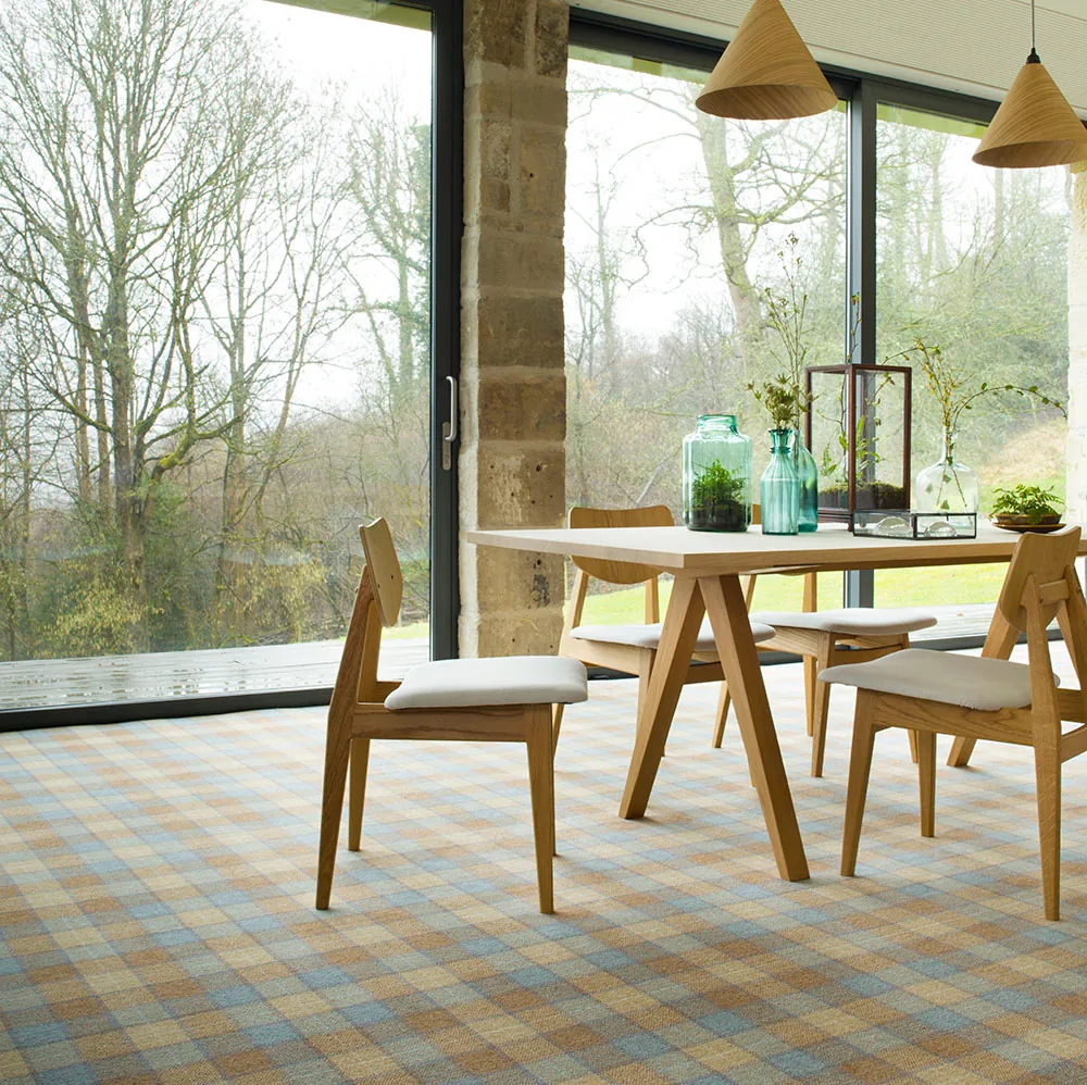 Brintons Abbotsford tartan carpet in a dining room with garden doors