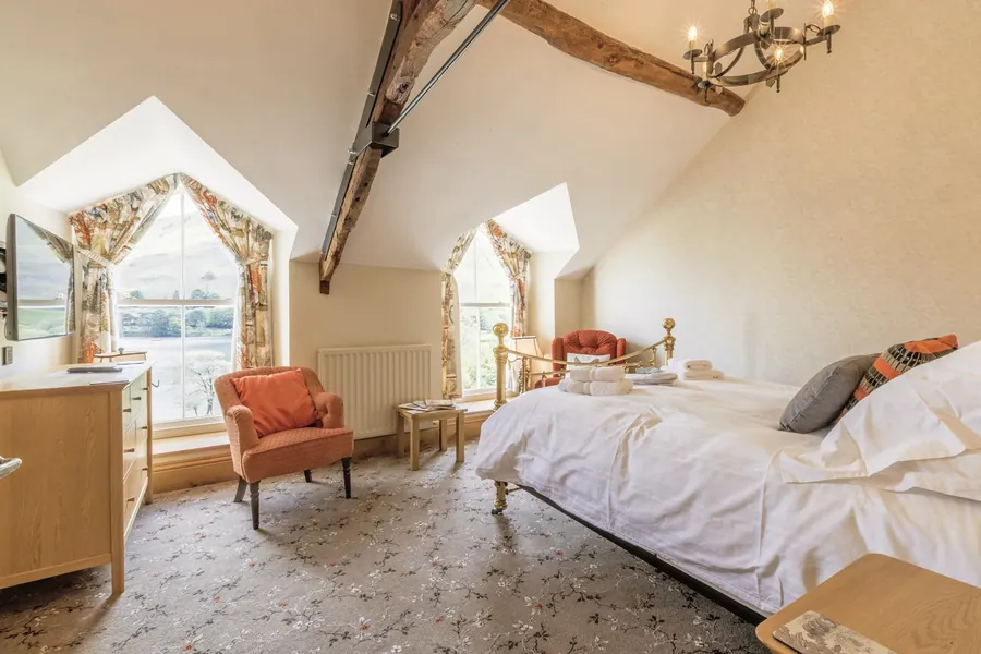 Ulster Blossom Camellia floral carpet in an attic bedroom