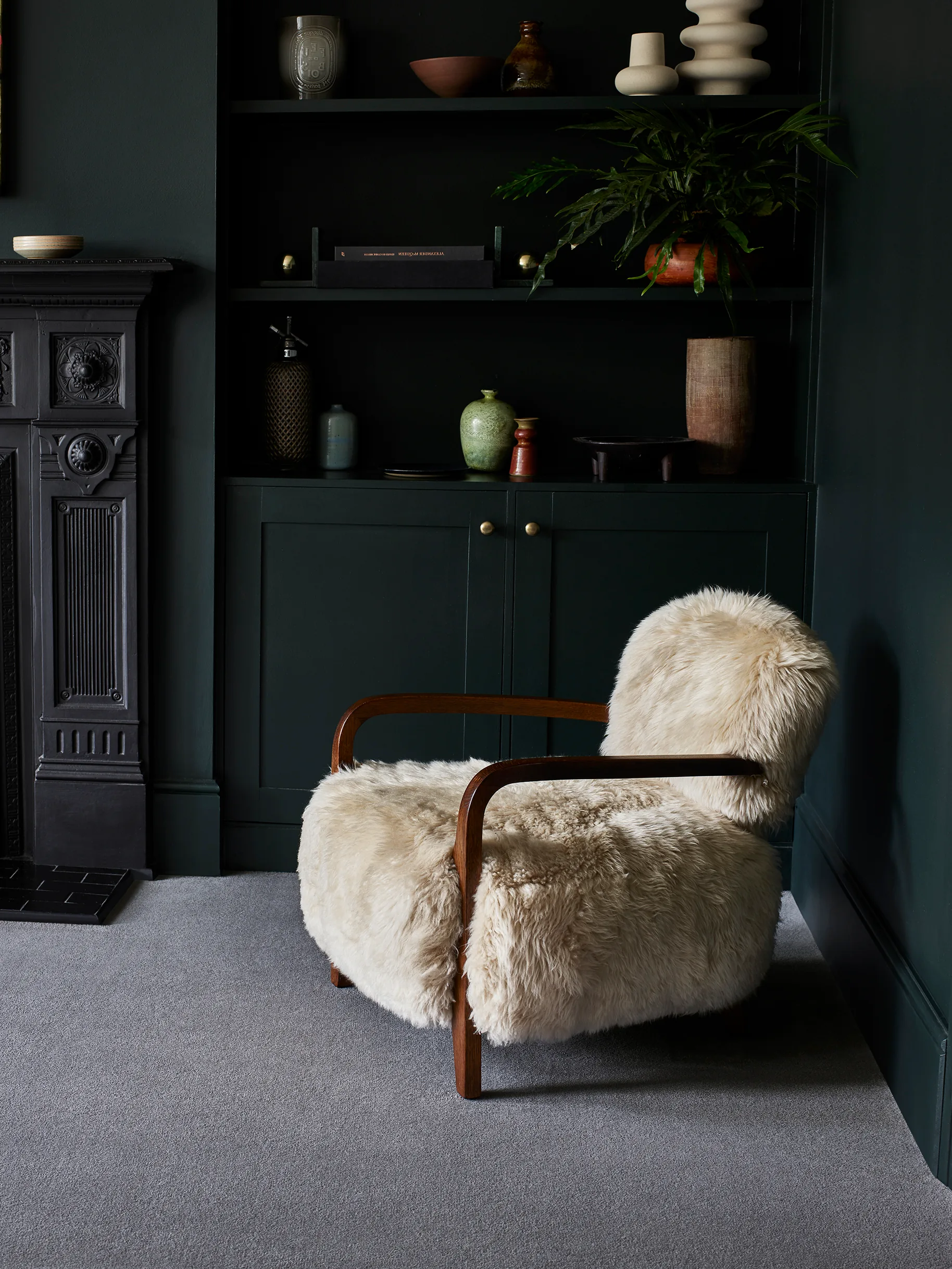 Brintons Chroma Anchovy carpet in a dark green sitting room