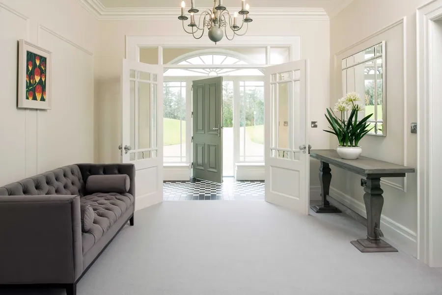 Ulster Grange Wilton Celadon carpet in a hall with garden doors