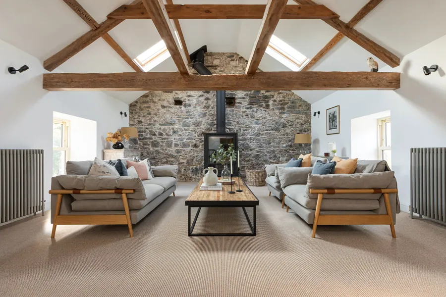 Ulster Habitus Strond Fallow carpet in a beamed sitting room