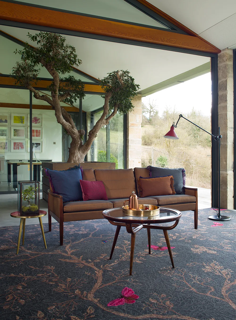 Brintons Timorous Beasties Ruskin Noir carpet in a garden room