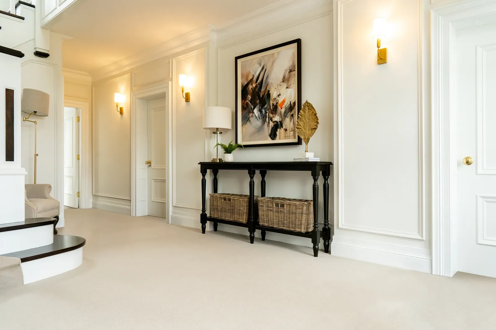 Ulster Grange Wilton Parmesan carpet in a panelled hall