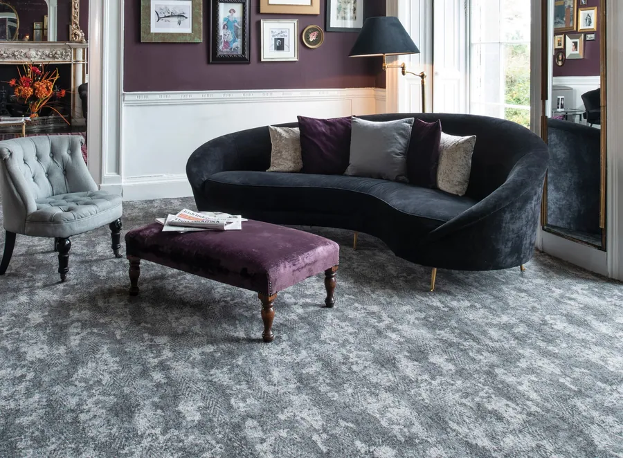 Ulster Vescent Vapor Ebony carpet in a sitting room with a fireplace